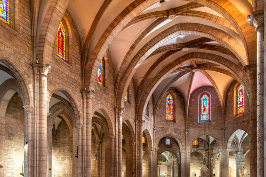 Valencia, Spain - october 01, 2026: Interior of historic gothic Church of Santa Catalina (Iglesia de Santa Catalina) ishowcasing stone pillars, ribbed vaults  and colorful stained glass windows.