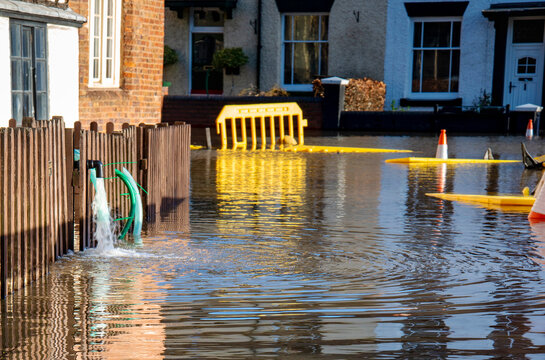 Bewdley flood water being pumped from riverside residential homes,near Bewdley Bridge,Worcestershire,England,UK.