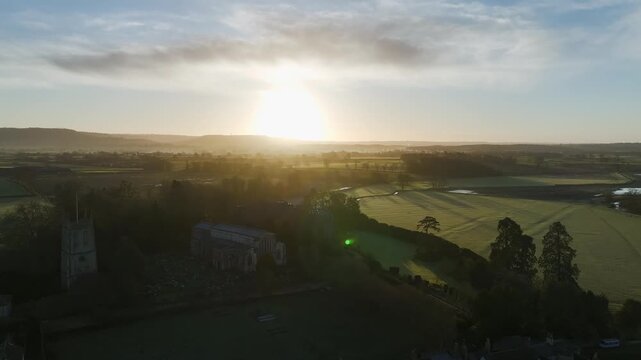 Sunrise over Berkeley Castle from a drone, Berkeley, Cotswolds, Gloucestershire, England, United Kingdom