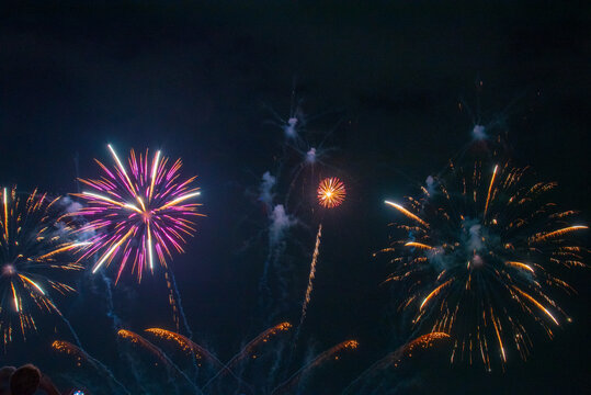 Purple firework in night time celebrate national holiday. Purple Firework celebrate anniversary happy new year 2027, 4th of july holiday festival. Violet firework Countdown to new year 2026 festival