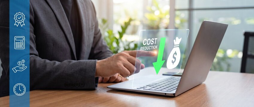 Businessman using laptop for cost reduction analysis