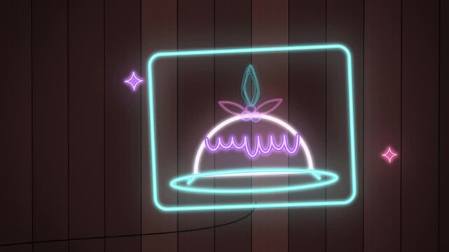 Purple neon christmas pudding sign flickering on wooden wall close-up
