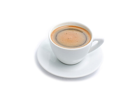 Side view close up of a white ceramic coffee cup with saucer filled with fresh black coffee isolated on a pure white background