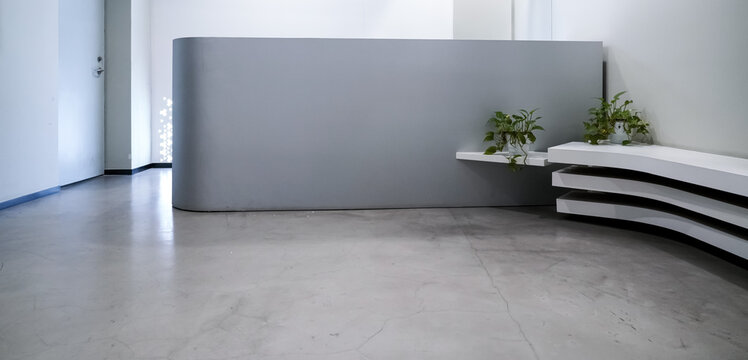 Minimalist grey curved reception desk with white layered bench and green pothos plants in modern office lobby