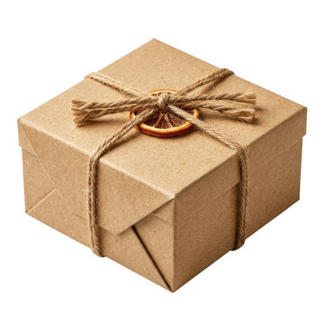 Gift box wrapped in brown craft paper with twine and a dried orange slice isolated on transparent background