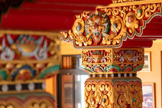 View of the intricately carved and painted wooden pillar at Namobuddha Monastery in Simalchaur Syampati, Bagmati Province, Nepal.