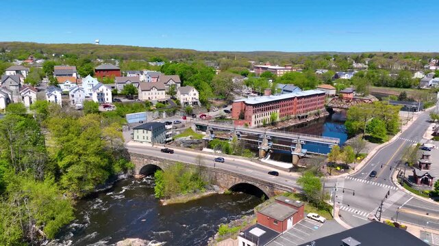 Main Street Bridge and Woonsocket Falls Dam on Blackstone River aerial view in downtown Woonsocket, Rhode Island RI, USA.