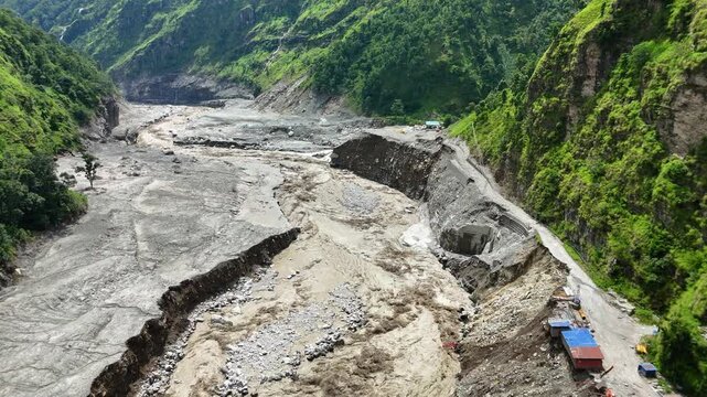 Kathmandu, Nepal - 31 August 2026: Aerial view of the Mailung Khola Jal Vidhyut Company Limited site showing extensive landslide damage and debris along the river valley.