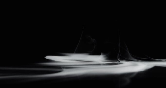 Real smoke swirling upwards like a hurricane or tornado. Vortex of wispy smoke spinning creating a mystical ghostly aura of the paranormal or a spooky Halloween background visual effect overlay.