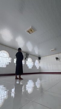 Person Praying Inside a Mosque