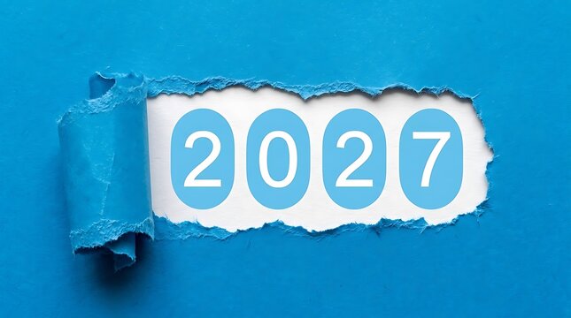 Blue torn paper hole revealing four pale circles spelling the year 2027