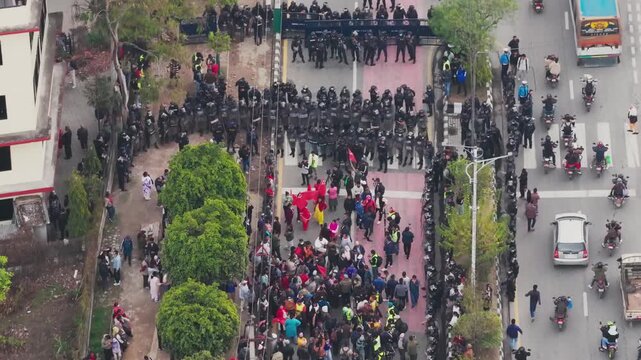 Kathmandu, Nepal - 29 March 2026: Aerial view of a protest at Maitighar Mandala with police in riot gear and demonstrators gathered on the street.