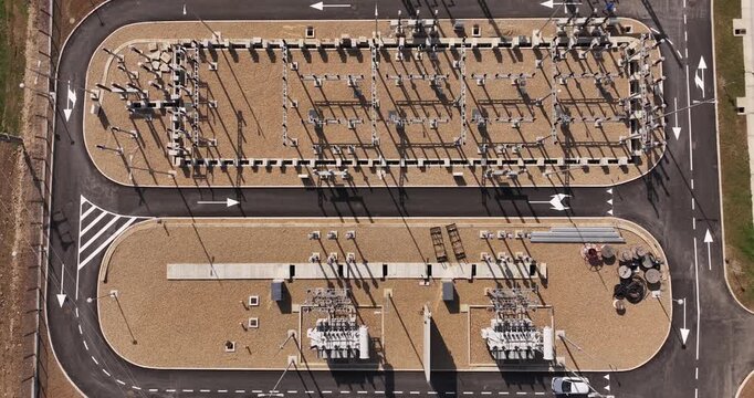 Serbia - 15 April 2026: Aerial view of an electrical substation with transformers, power lines, and gravel ground.