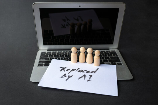 Wooden Figures on Laptop with Replaced by AI Note.