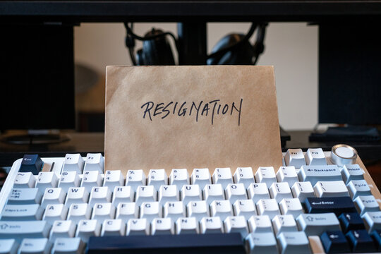 Resignation letter on top of keyboard. Quit job concept.