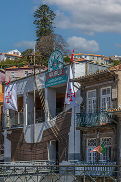 Porto, Portugal - April 11, 2024: Facade of the World of Discoveries museum, an interactive attraction on the Douro River showcasing Portugal's Age of Discovery heritage.