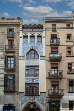 Barcelona, Spain - April 15, 2024: Casa Doctor Genov&eacute; on La Rambla, a Catalan Modernist landmark featuring colorful ceramic mosaics, Gothic arches, and rich ornamental details.