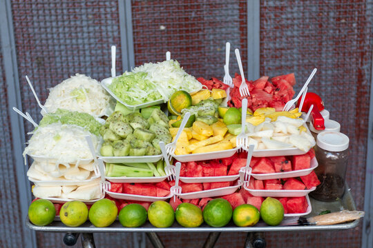 Fresh Chopped Fruit in Disposable Plates at a Mexican Street Food Stall
