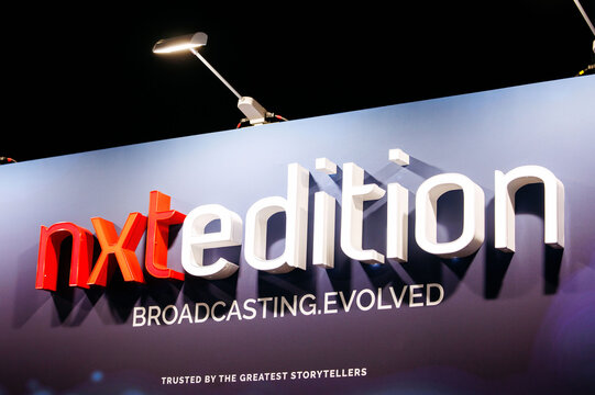 Amsterdam, Netherlands - September 12, 2026: Nxtedition broadcasting evolved sign with illuminated three dimensional lettering at IBC media and technology exhibition