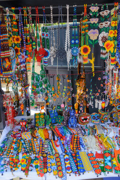 Colorful Huichol Beaded Necklaces Hanging at Mexican Artisan Market Stall