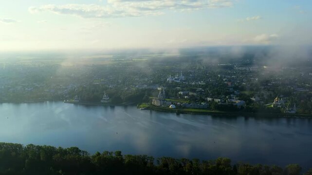 Uglich, Russia. Uglich city from the air. Flying in the clouds. Volga river. Early morning. Drone footage