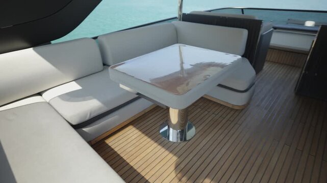 Luxury Yacht Flybridge Lounge with Large Corner Sofa and Wooden Lunch Table