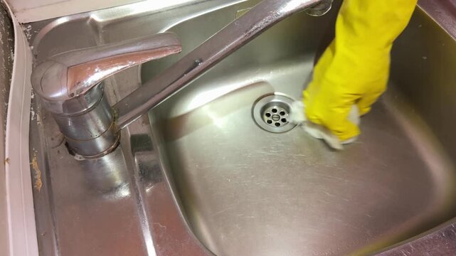Dry Wiping and Polishing Clean Stainless Steel Sink