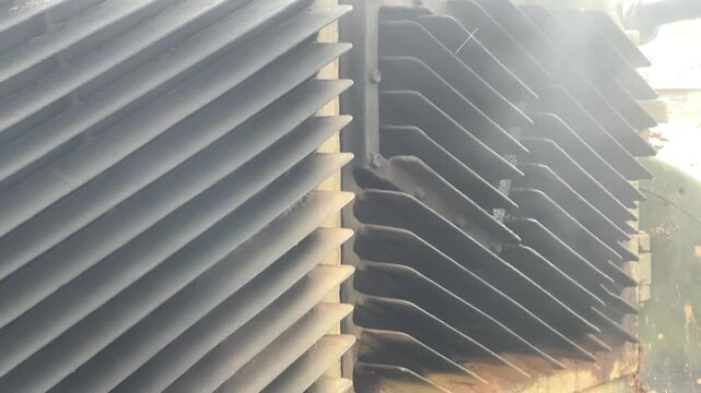 Close up shot of abstract industrial metallic cooling fins and heavy engine radiator patterns.