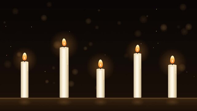 Row of lit white candles with dancing flames and melting wax, warm cozy bokeh background