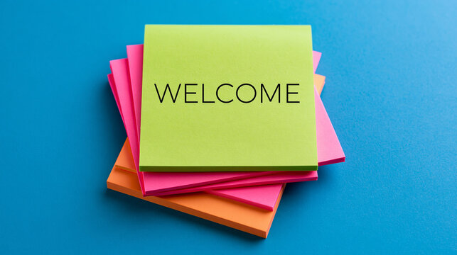 Welcome message written on bright sticky notes over a blue background. Ideal for business introduction concepts and human resources recruitment ads.