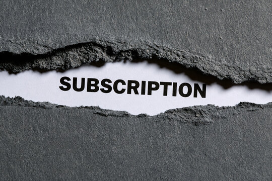 The word subscription is revealed through a torn black paper background. Perfect business concept for digital services and membership marketing.