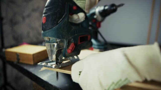 Electric Jigsaw Cutting Wooden Board In Workshop. Woodworking