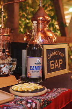 2026.10.14, Russia: Samogon bar setup with bottle and orange slices