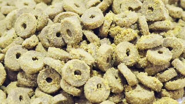 Close-up of ring-shaped animals feed pellets