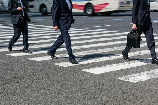 Businessman walking on crosswalk City street People lifestyle Asian Business