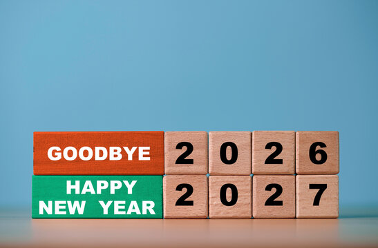 Goodbye 2026 and Happy New Year 2027 message on colorful wooden blocks symbolizing new year beginnings transition for fresh start and holiday future celebration.
