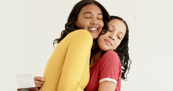 Embracing warmly, African American mother and daughter expressing love and connection