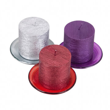 Textured pillar candles resting on glass plates