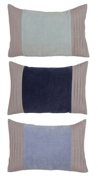 Decorative pillows stacked in blue and taupe textured fabrics