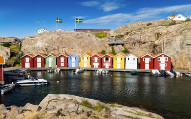 Colorful boathouse background with boats are moored on the water © stockphoto-graf
