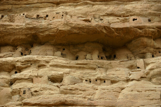 Rows of Tellem mud structures tucked under an overhang of the sandstone cliff, Mopti Region, Bandiagara, Mali