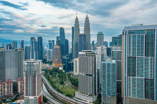Kuala Lumpur city skyline with twin skyscrapers, residential and commercial high-rise buildings in Malaysia. Urban development, business district, modern architecture, transportation infrastructure