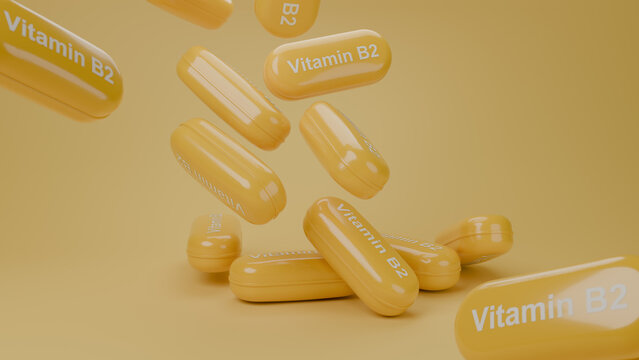 3D render of multiple yellow glossy Vitamin B2 supplement capsules falling on yellow background