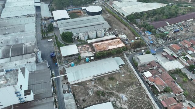 Aerial top down view of industrial water treatment plant and circular purification tanks in West Java