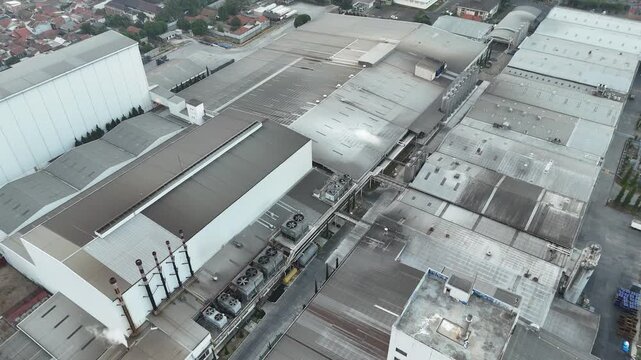 Aerial view of large industrial infrastructure, factories, and manufacturing facilities in West Java