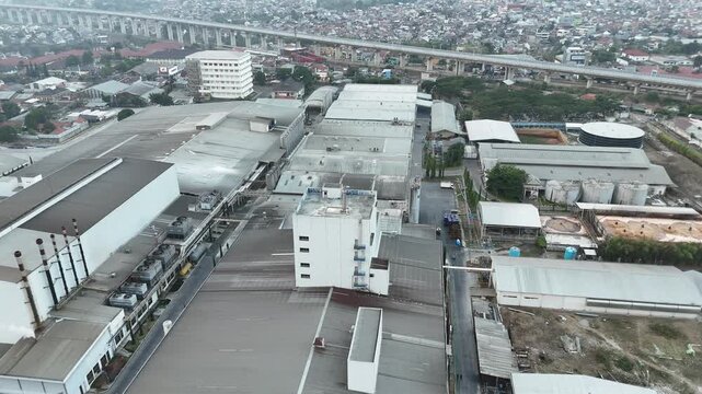 Aerial view of large industrial infrastructure, factories, and manufacturing facilities in West Java