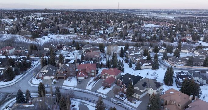Aerial view of a residential neighborhood blanketed in snow on a winter day in Calgary, Alberta, Canada.	