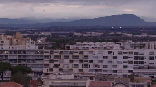 Close view of Carnon apartment buildings with mountains behind