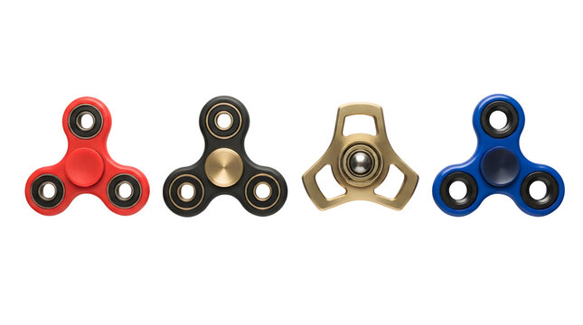 Four distinct fidget spinners are arranged in a horizontal row on a white background, featuring a red plastic model, a black model with brass accents, a metallic brass version, and a blue spinner