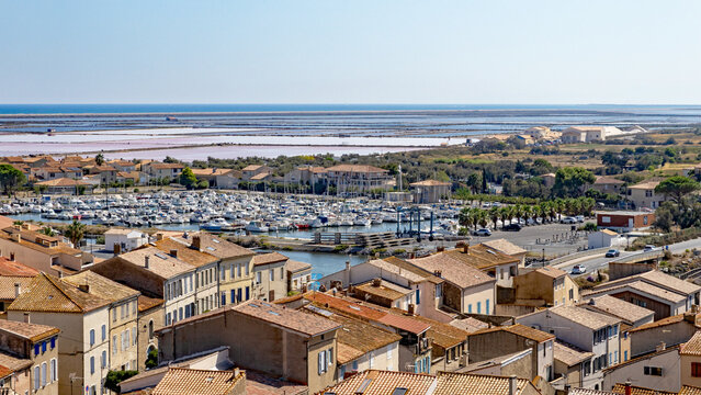 Panoramic view of Gruissan (Aude, France) seen from the Tour Barberousse on a sunny day in summer, with the Nautical Club Harbor, the  &Icirc;le Saint-Martin salines and the Mediterranean Sea